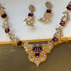 Diamond and purple colored necklace with earrings